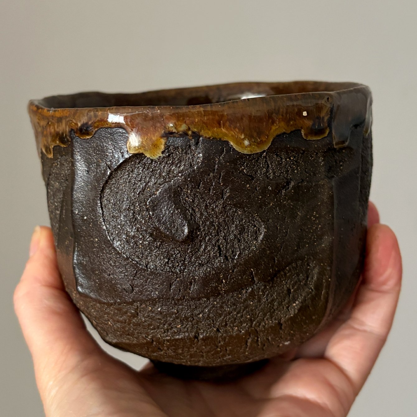 Front view of handmade Kurinuki ceramic chawan