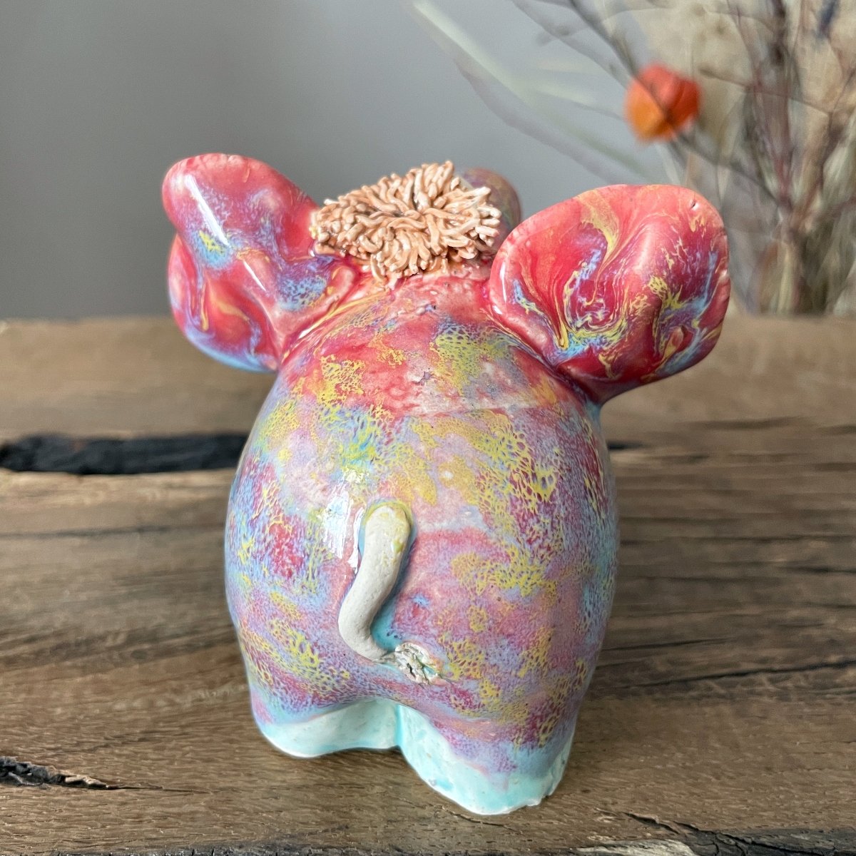 Detailed blue glazed feet of a sturdy ceramic elephant figurine showing high-quality craftsmanship