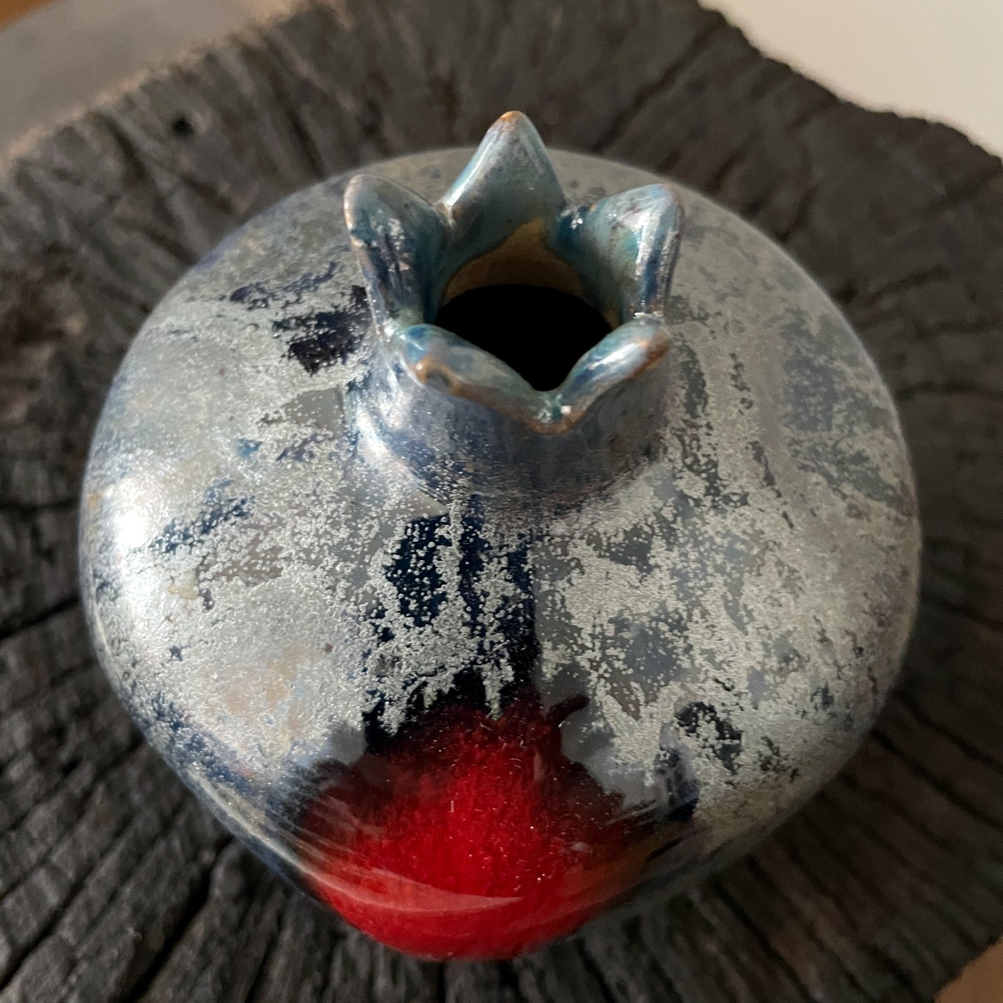 Handmade pottery pomegranate figurine with blue black finish