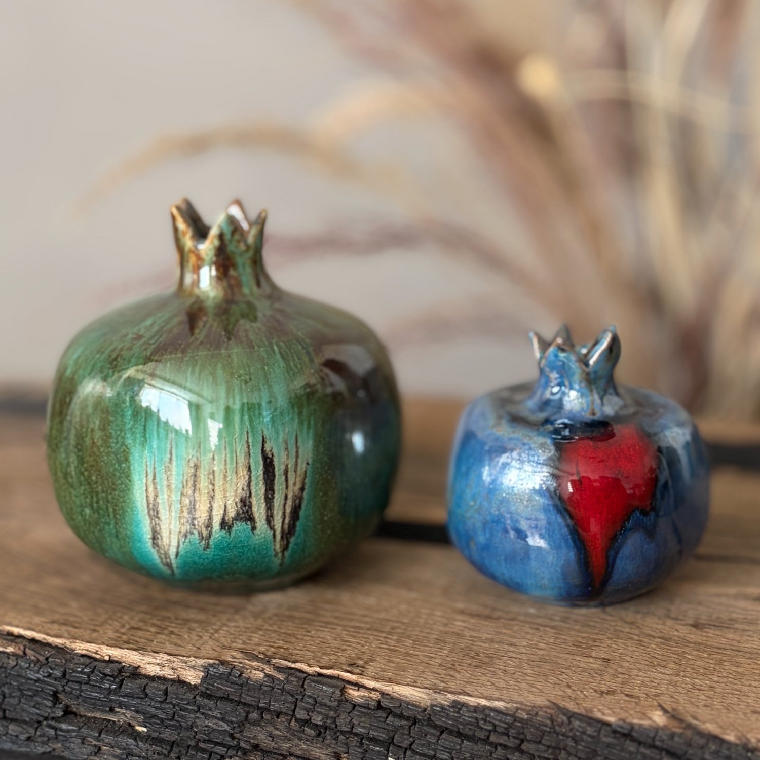 Green ceramic pomegranate vase with turquoise glaze accents