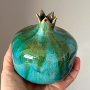 Sculptural handmade pomegranate with turquoise and earthy glaze