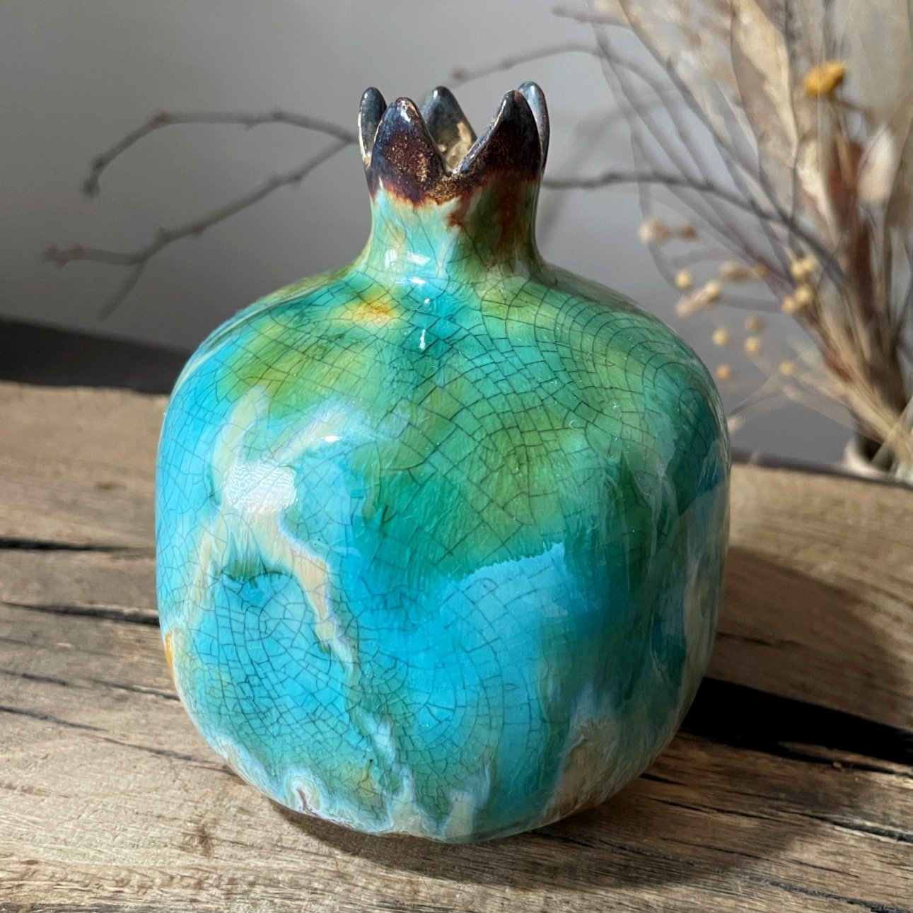 Handcrafted turquoise pottery vase with crackled glaze texture