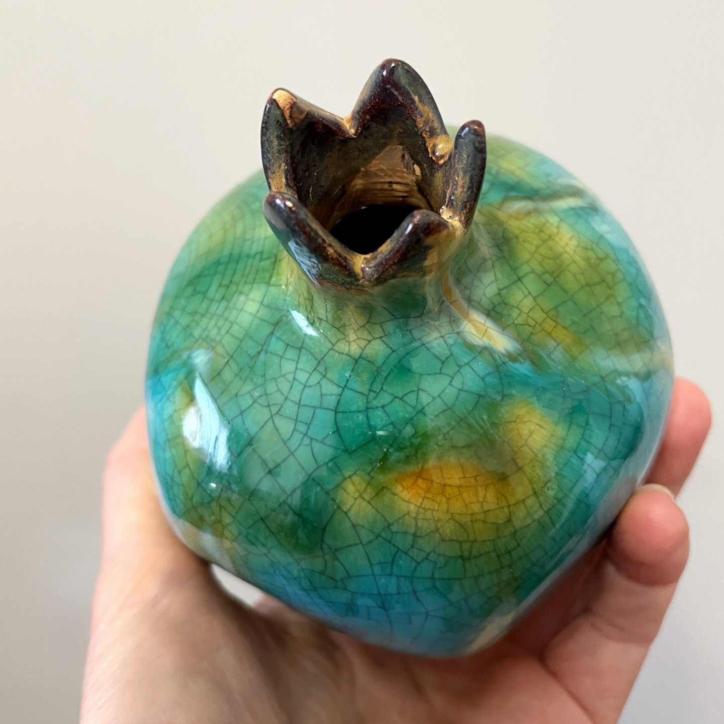 Small pomegranate shaped vase with aqua crackle finish
