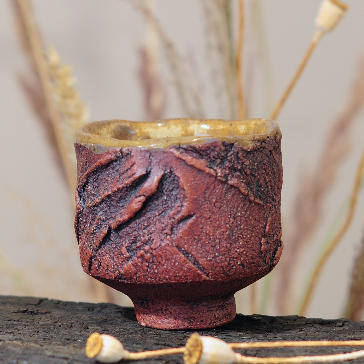 Wabi sabi ceramic yunomi tea cup with carved exterior