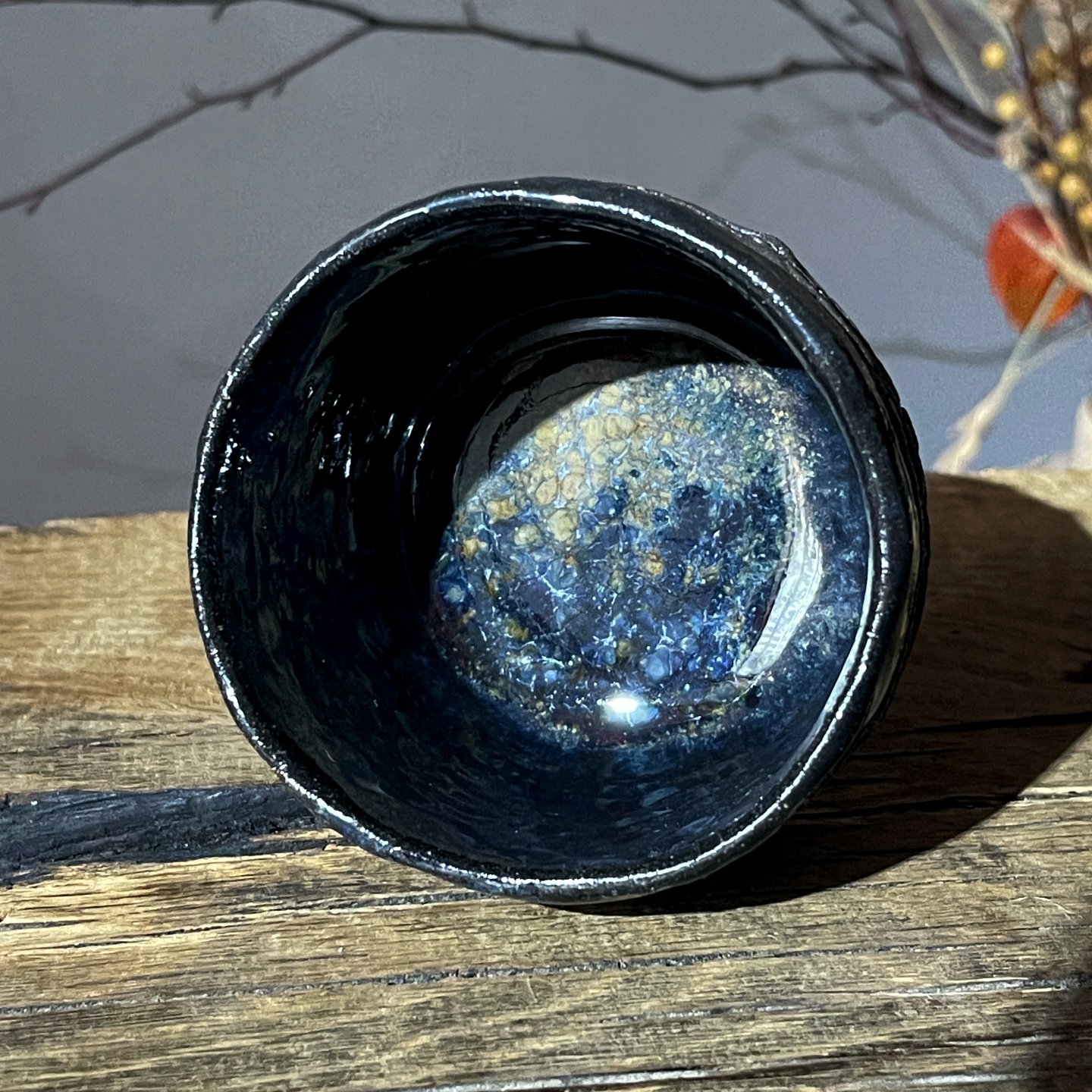 Top view of handmade ceramic yunomi with dark glazed interior