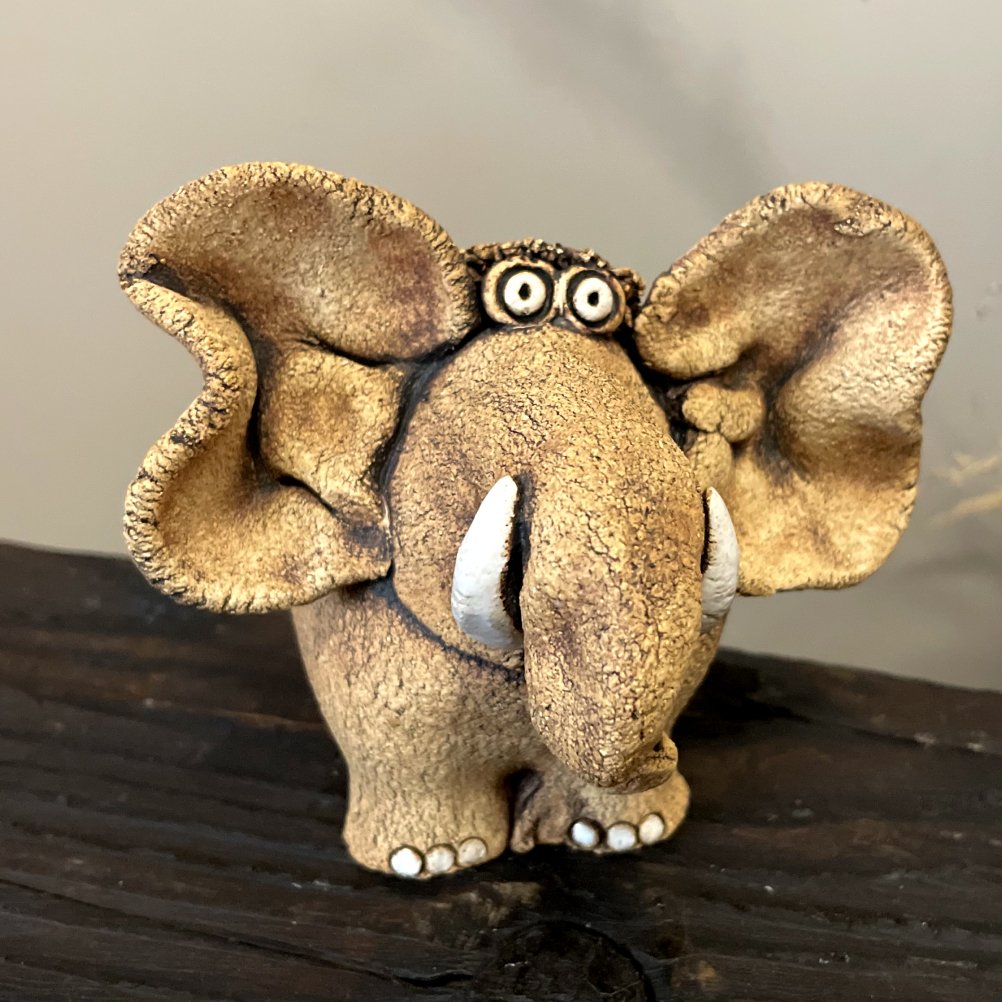 Natural unglazed surface of handmade ceramic elephant sculpture