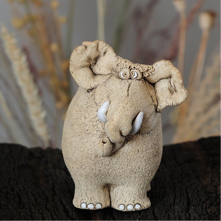 expressive ceramic elephant figurine — collectible sculpture art