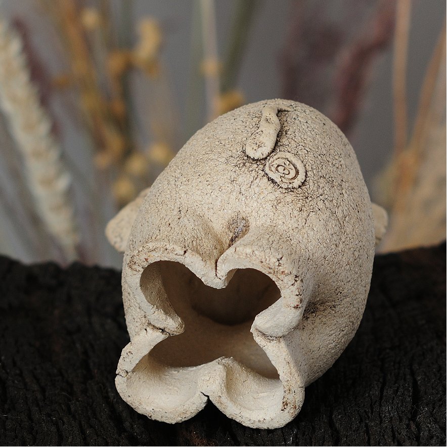 Unglazed white clay surface of handmade ceramic elephant — Tyrsa artwork