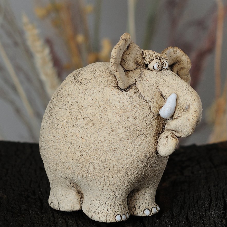 Handcrafted ceramic elephant sculpture side angle — one-of-a-kind art piece