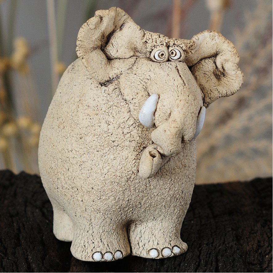 Expressive handmade ceramic elephant figurine front view — Tyrson Ceramics