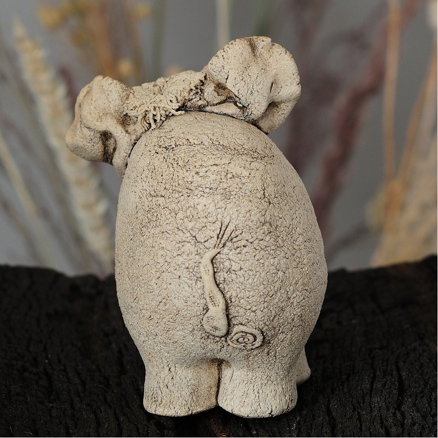 nique ceramic elephant figurine back view with natural clay texture