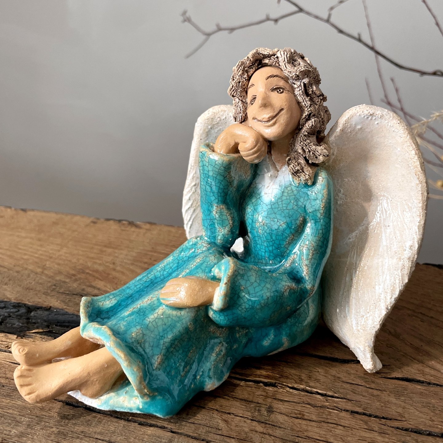 Ceramic angel figurine with peaceful expression