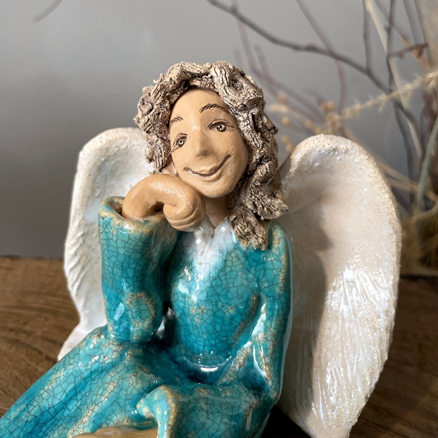 Front view of handmade ceramic angel sculpture