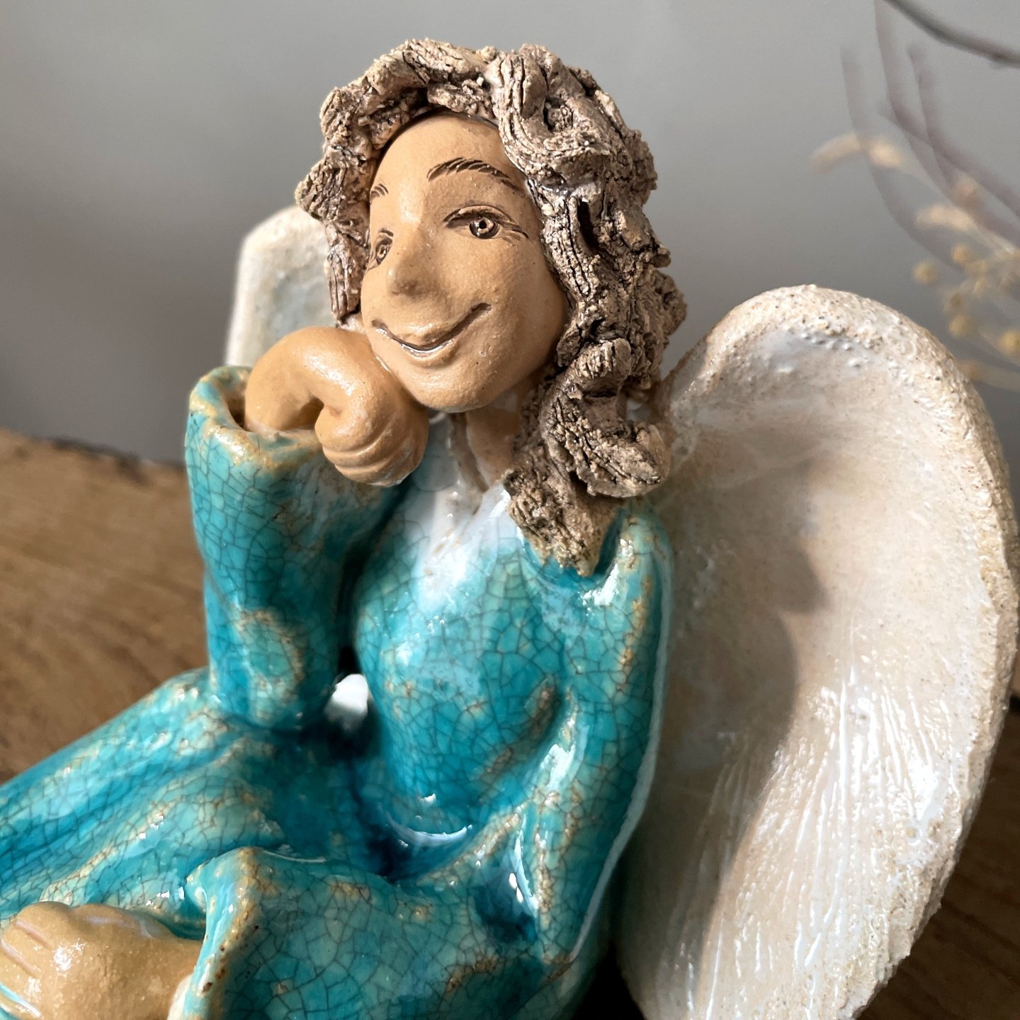 Close-up of handmade ceramic angel face