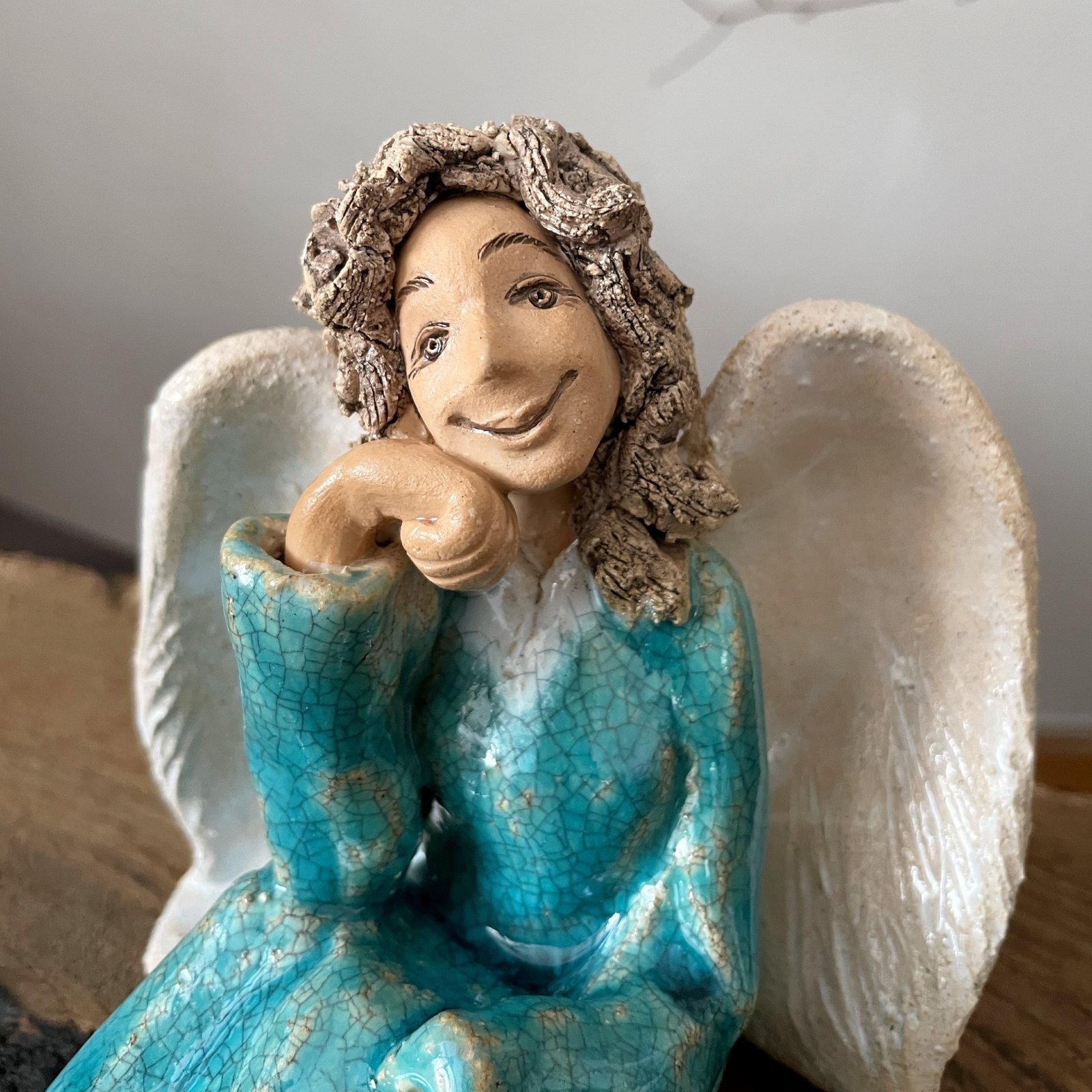 Ceramic guardian angel sculpture in turquoise and white