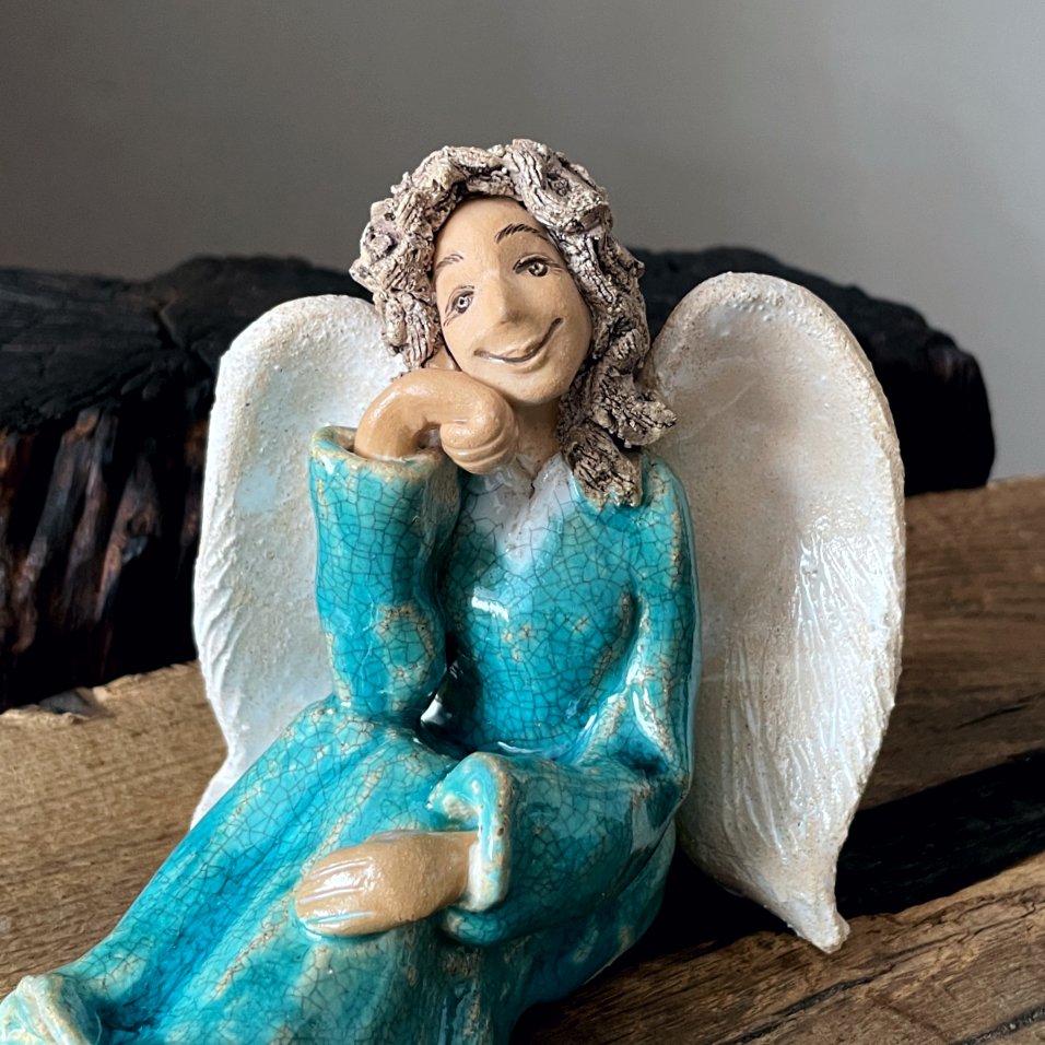 Handmade ceramic angel figurine in turquoise dress