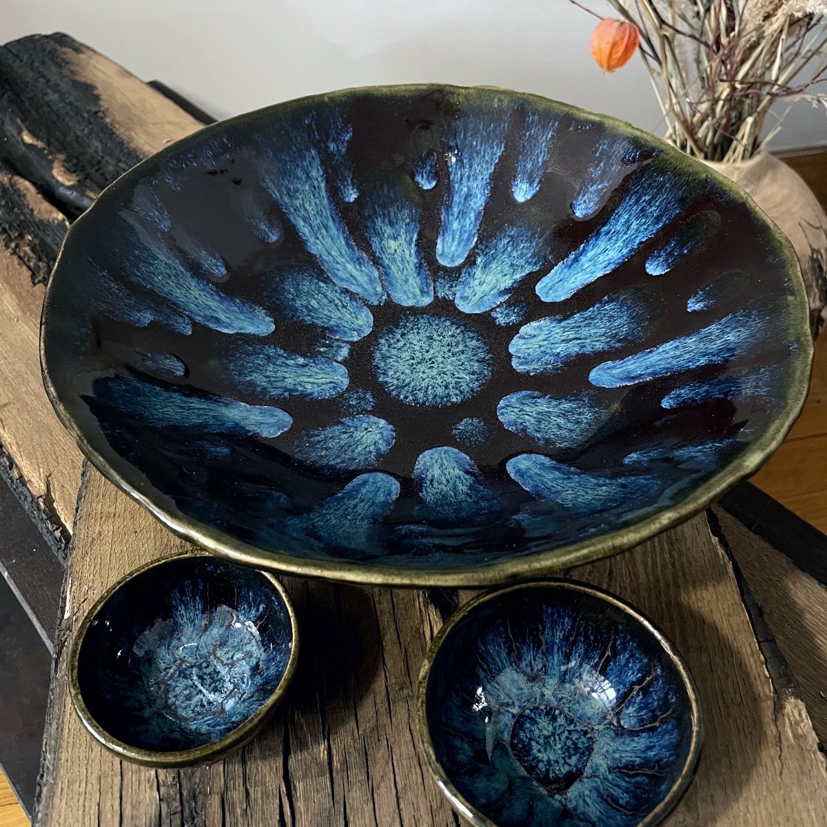 handmade stoneware plate dark glaze blue center detail