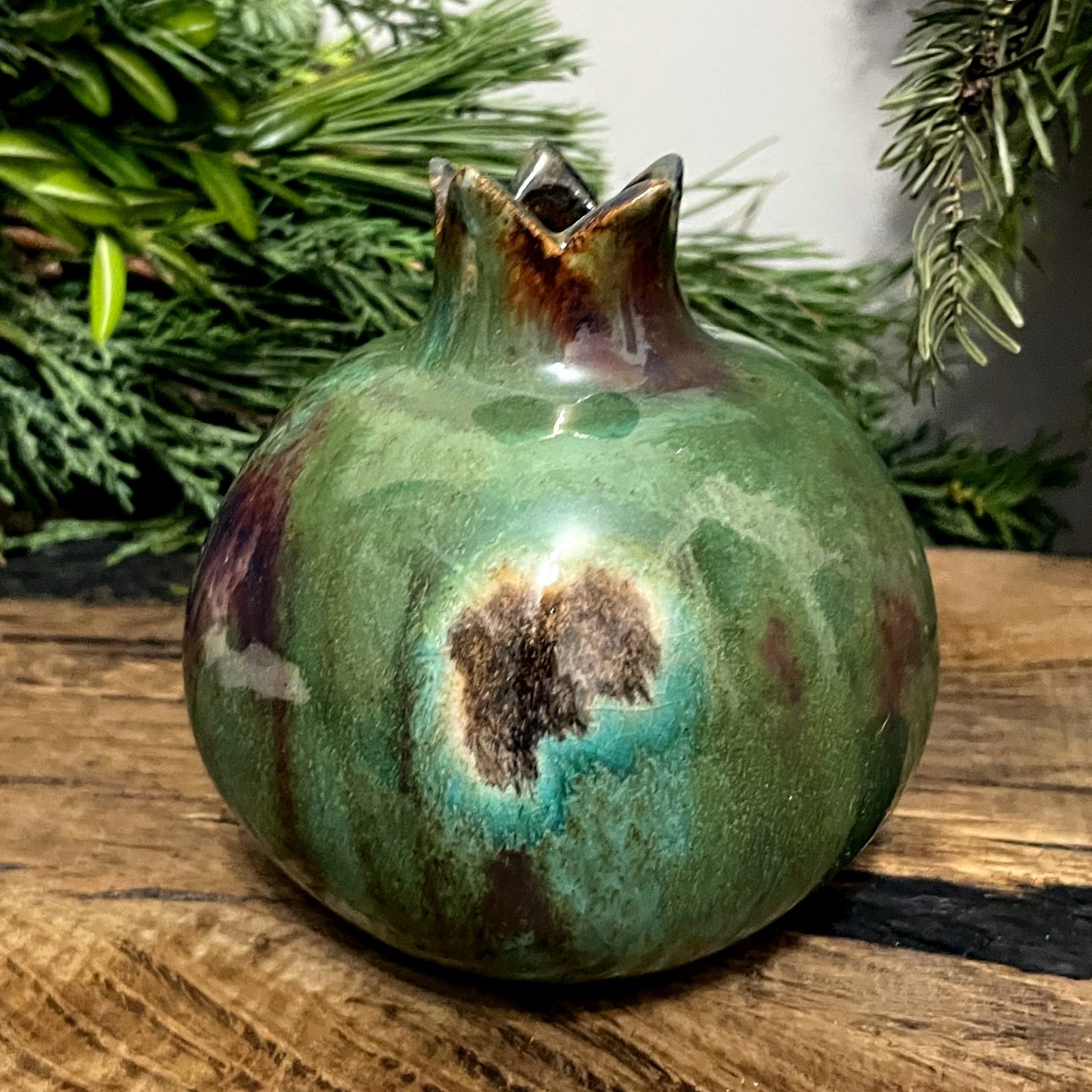 Handmade ceramic pomegranate vase with green glazed surface