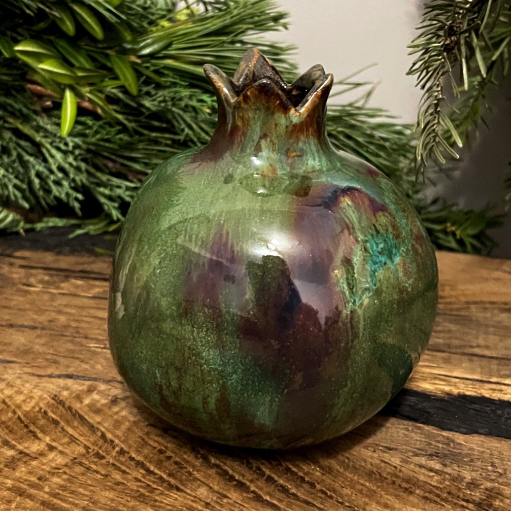 Handmade pottery pomegranate used as small flower vase