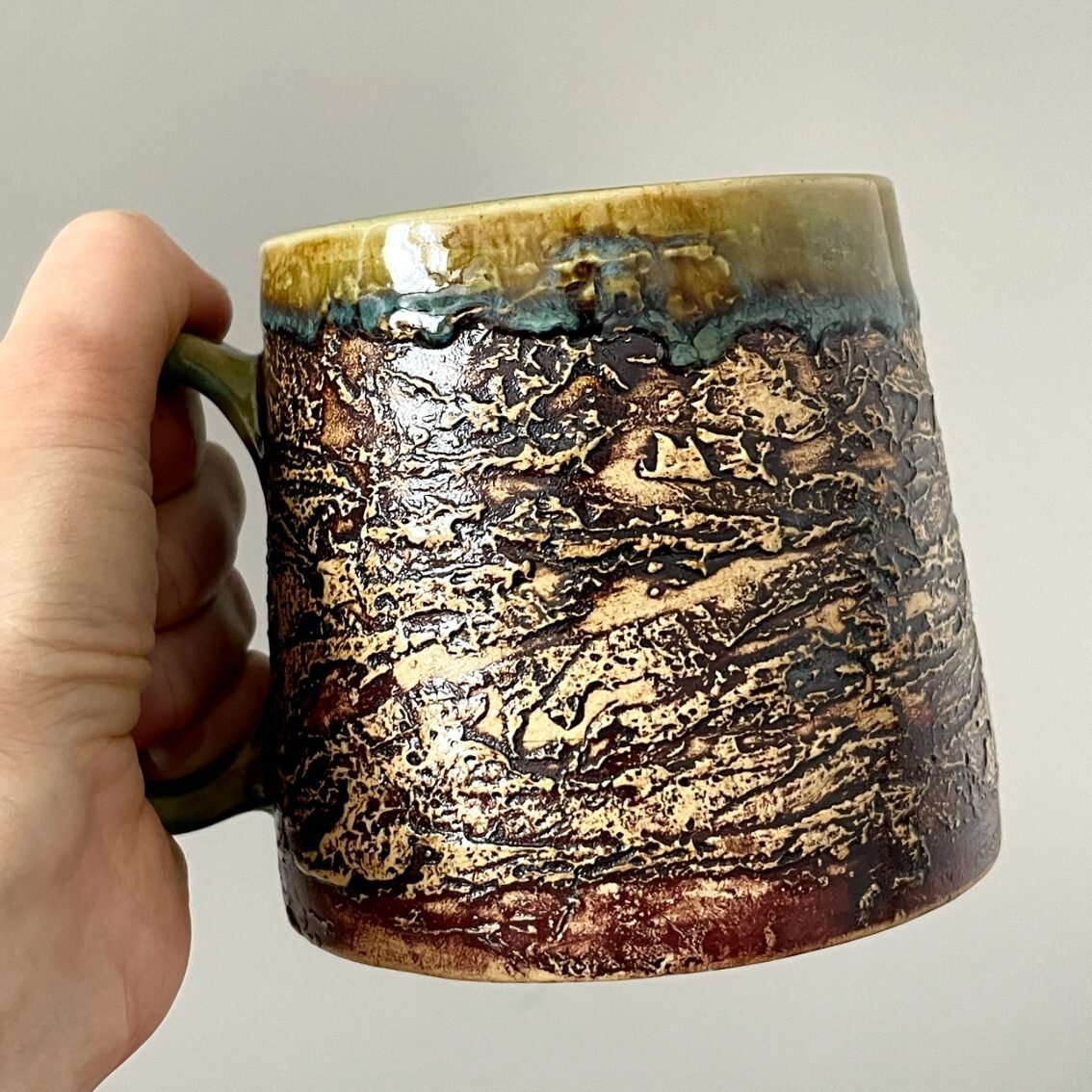 Handmade ceramic coffee mug 450 ml with rustic textured surface