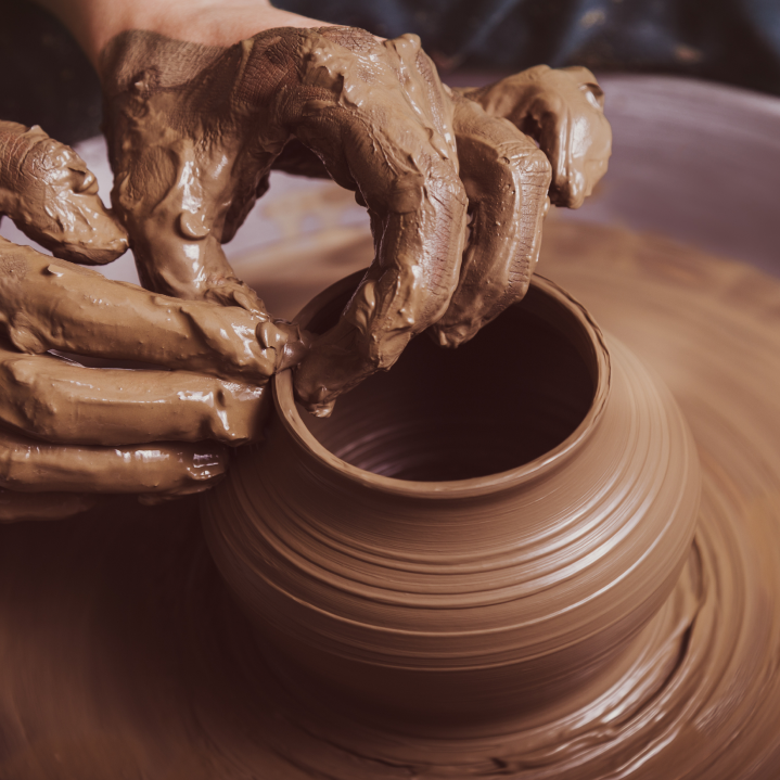 hands-potter-creating-earthen-jar